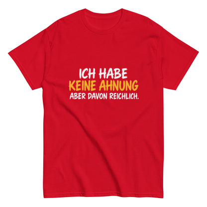 Lustiges T-Shirt mit dem Spruch „Ich habe keine Ahnung, aber davon reichlich.“ in weißer und gelber Schrift auf schwarzem Hintergrund.