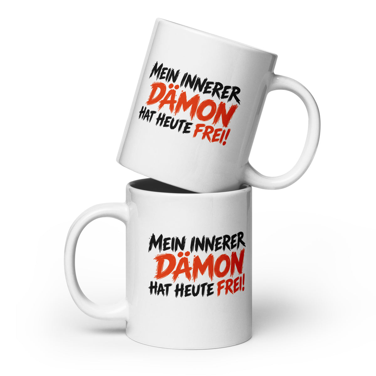 Weiße Keramiktasse mit schwarzem und orangefarbenem Spruch „Mein innerer Dämon hat heute frei!“ – lustige Tasse mit schwarzem Humor.